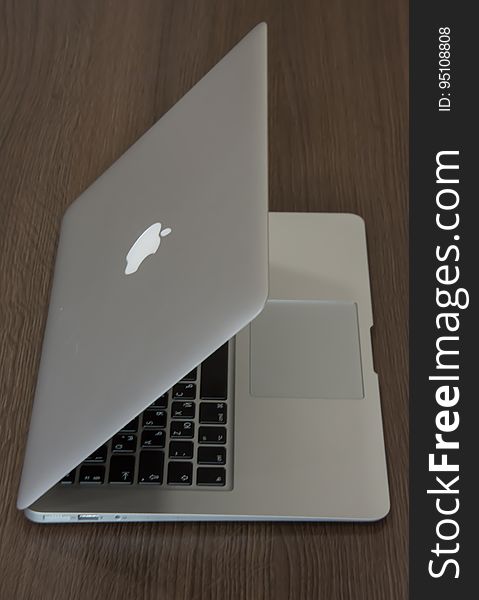 An Apple Macbook on a desk.
