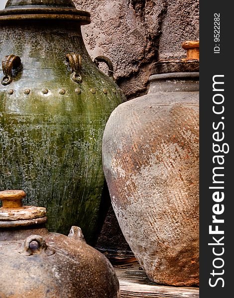 Weathered and textured abstract portions of Asian pottery jars.