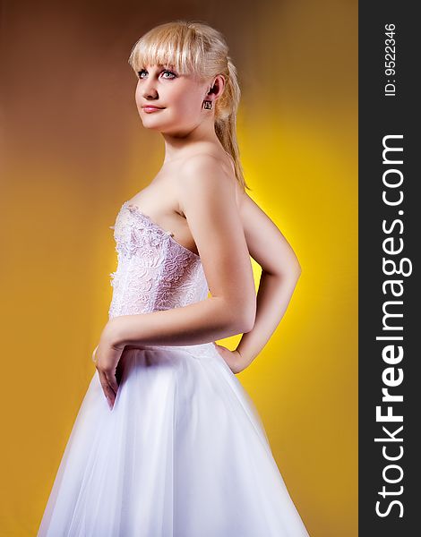 Pretty young blonde in wedding dress