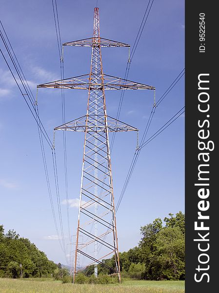 High power electricity lines against the blue sky. High power electricity lines against the blue sky.