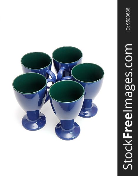 Circle of five blue long-stemmed coffee cups isolated. Circle of five blue long-stemmed coffee cups isolated
