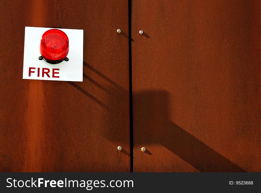 Fire alert sign with light on building