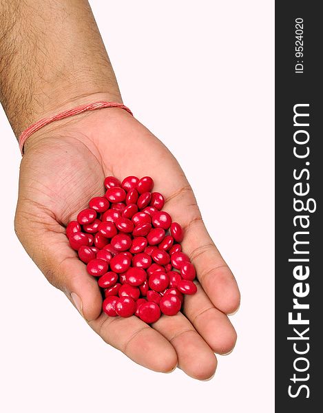 Red tablets on hand