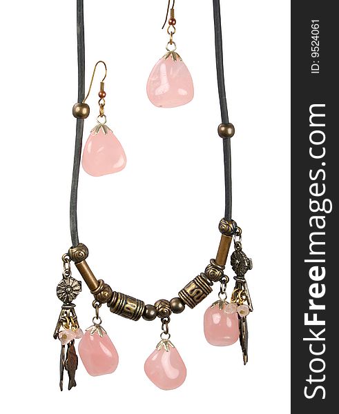 Female ornament a suspension bracket and earrings with pink quartz on a white background