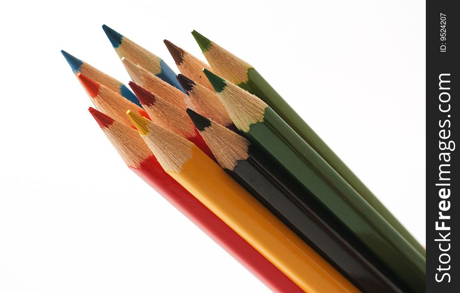 Colourful pencils on white background