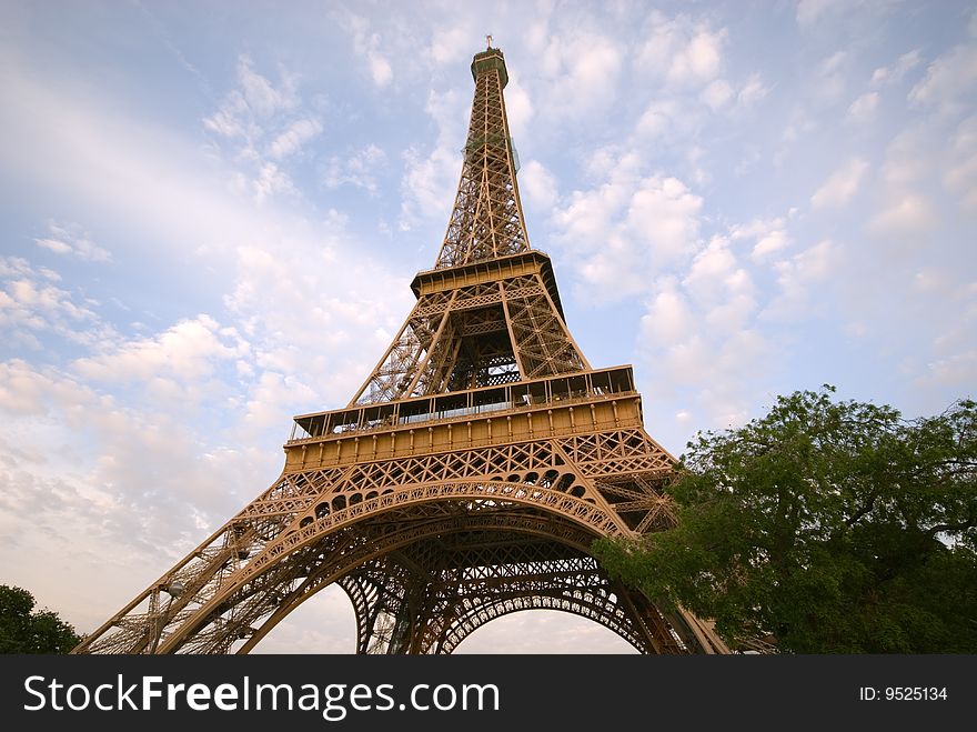 Eiffel Tower, most visited landmark of Paris, is seen here from Champs de Mars, during a nice sunny day. Eiffel Tower, most visited landmark of Paris, is seen here from Champs de Mars, during a nice sunny day.