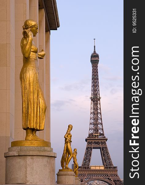 Gilded statues of the Trocadero are seen here in late afternoon light, with the Eiffel tower in the background. Gilded statues of the Trocadero are seen here in late afternoon light, with the Eiffel tower in the background.