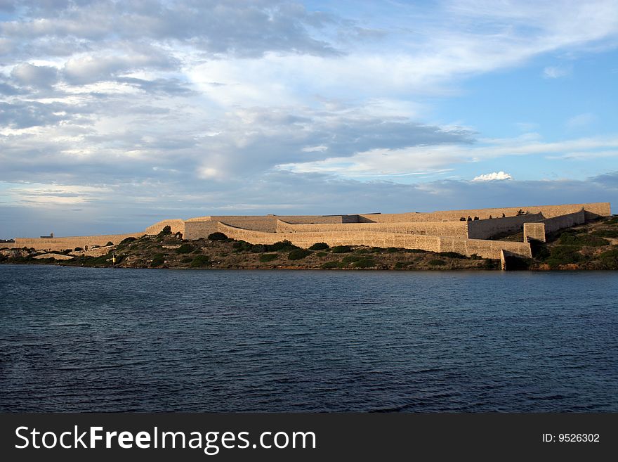 Wall of a fortress on a coast of Menorca in Balearic islands