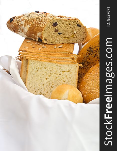 A variety of freshly baked breads in a basket. A variety of freshly baked breads in a basket
