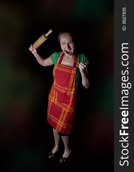 Woman with kitchen tool (rolling pin)