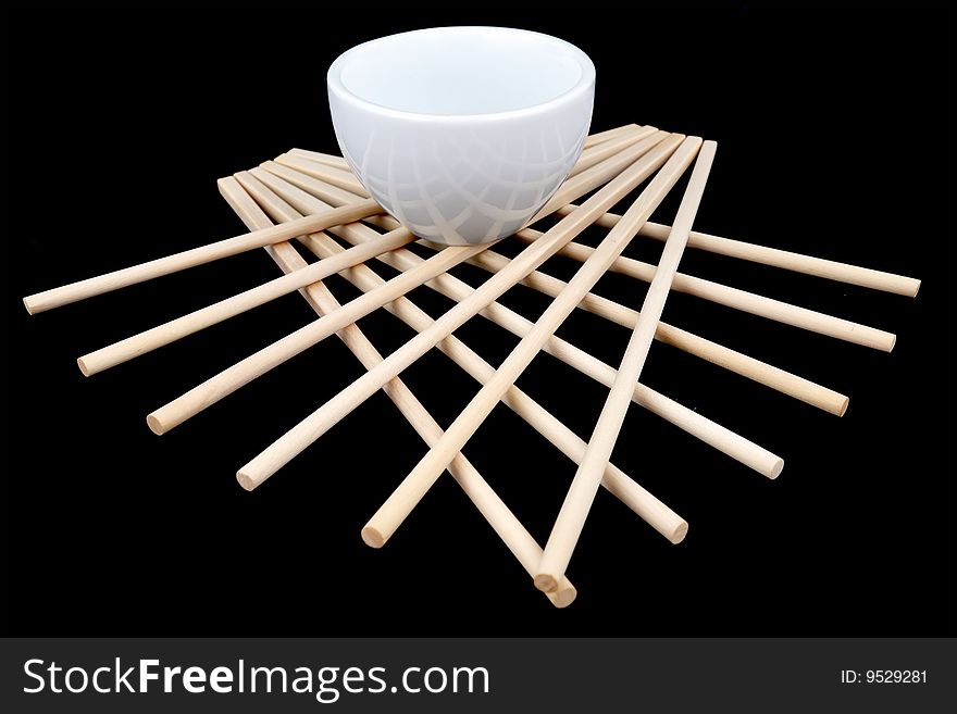 Chopsticks and white bowl as a table decoration under Asian Art