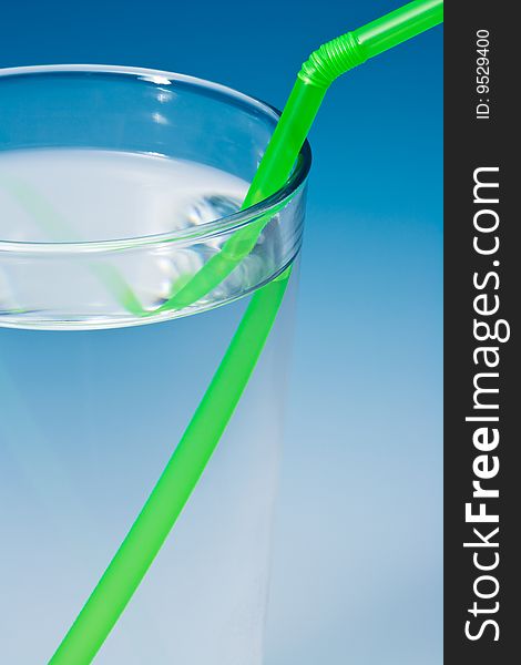Glass of water on blue gradient background