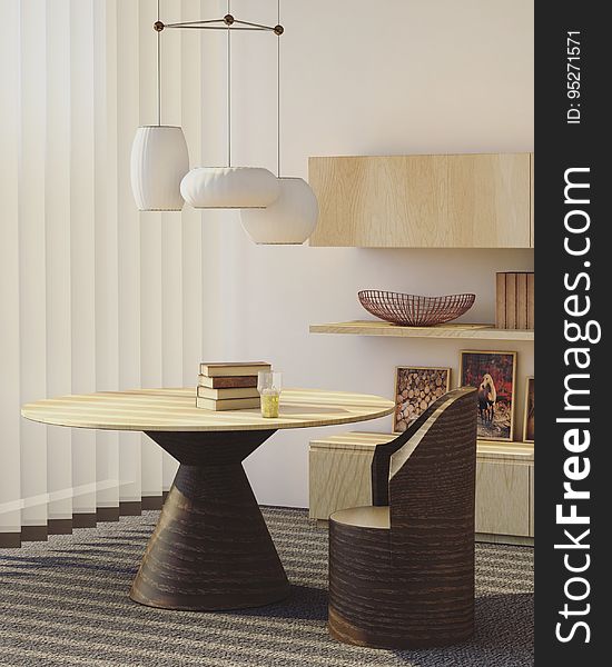 A pile of books on a table in a modern living room. A pile of books on a table in a modern living room.