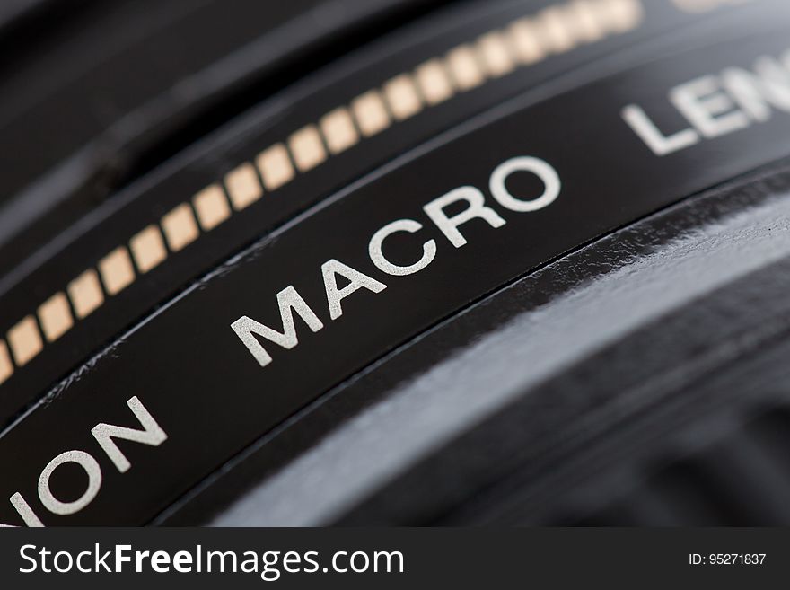 A close up of a macro lens on a professional camera.