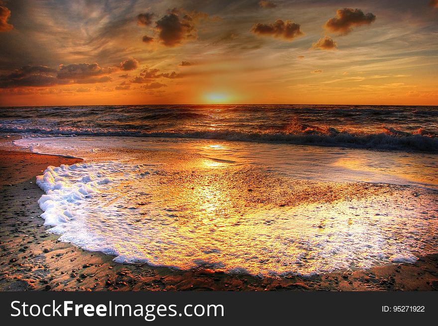 Incoming Tide At Sunset