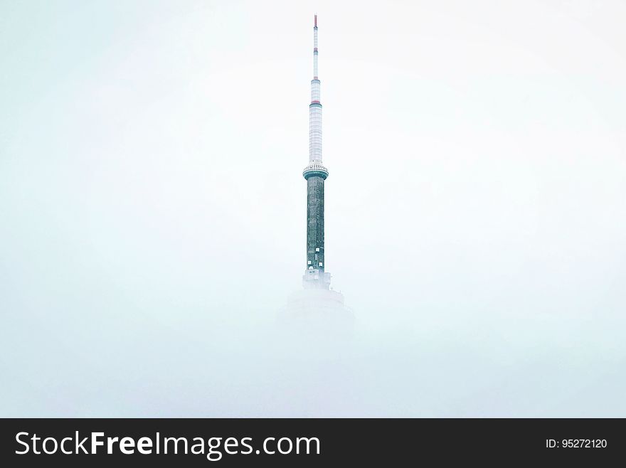 A tower peeking from the mist. A tower peeking from the mist.