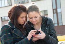 Young Girls Watch Something In Mobile Phone Stock Photo