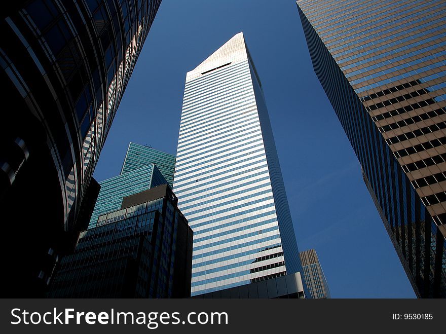 The soaring Citicorp Tower with its distinctive triangular top is a landmark skyscraper located at Lexington Avenue and East 53rd Street in Manhattan - Lee Snider Photo. The soaring Citicorp Tower with its distinctive triangular top is a landmark skyscraper located at Lexington Avenue and East 53rd Street in Manhattan - Lee Snider Photo.