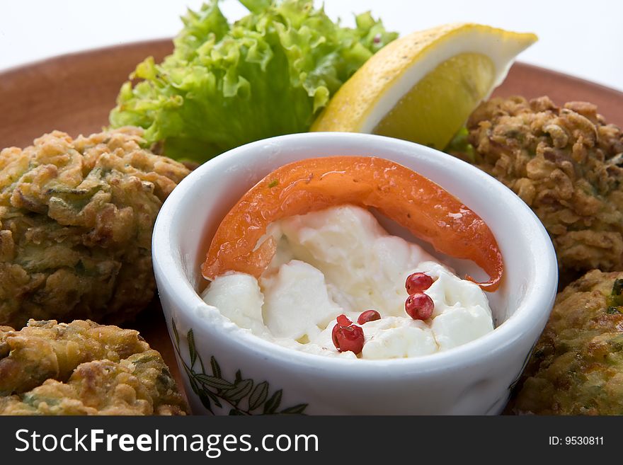 Traditional starter palte with fried marrows balls with garlic sauce. Traditional starter palte with fried marrows balls with garlic sauce