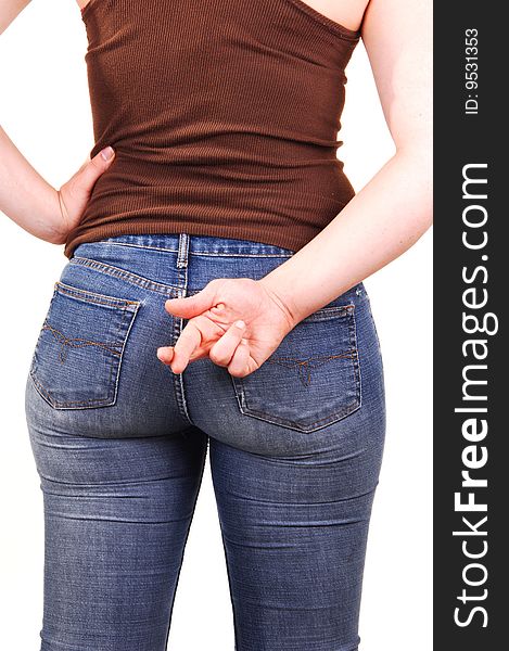 The back of a young girl, in a brown top and blue jeans, with the nice round and the right hand with the grossed fingers. The back of a young girl, in a brown top and blue jeans, with the nice round and the right hand with the grossed fingers.