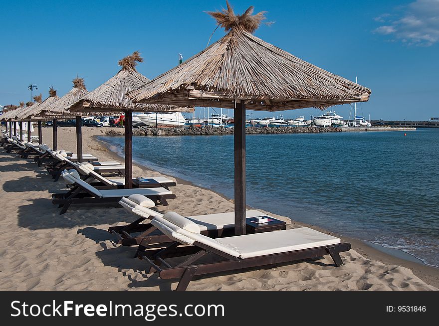 Chaise lounges on the bank of the black sea