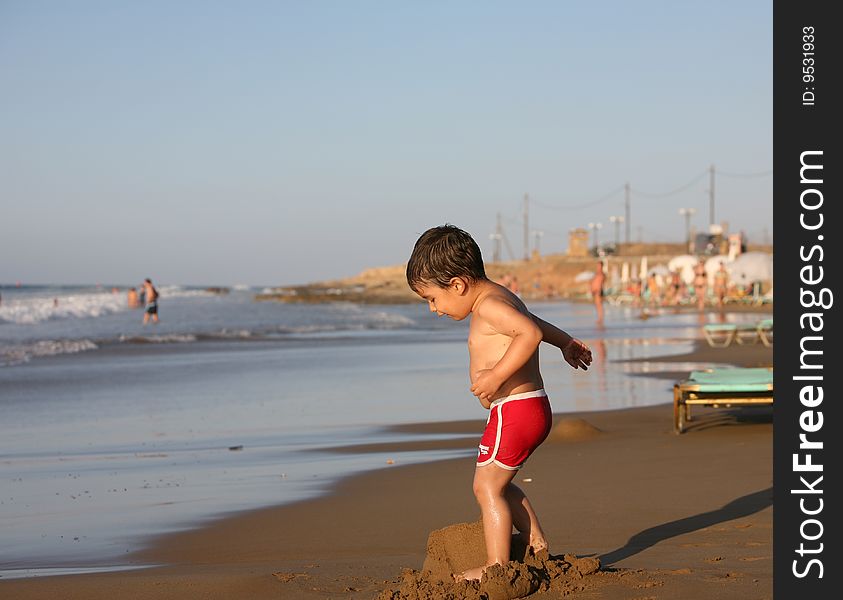 Boy playing at the beach. Boy playing at the beach