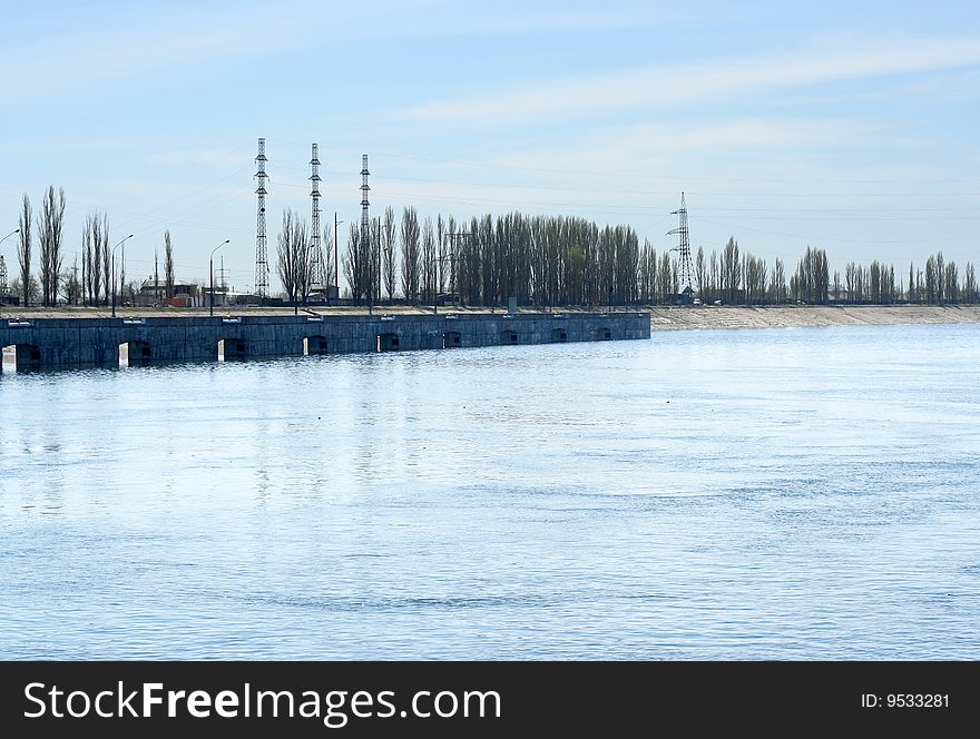 Tempestuous water river beside city. Tempestuous water river beside city