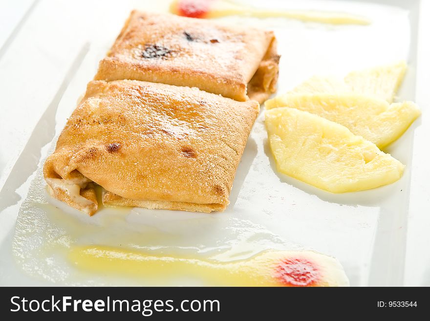 Pancake filled with pineapple custard, glazed with sugar