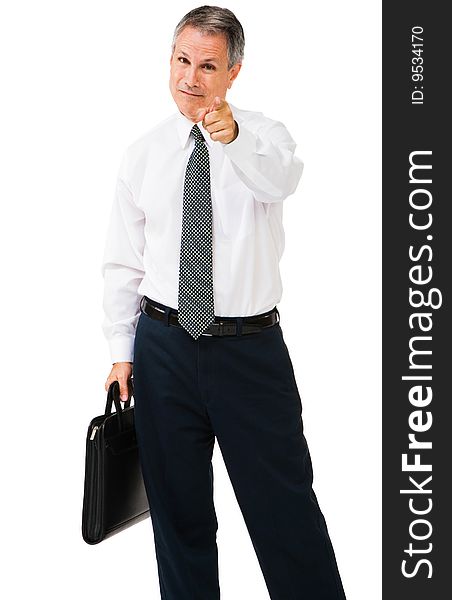 Businesman carrying a briefcase and pointing isolated over white. Businesman carrying a briefcase and pointing isolated over white
