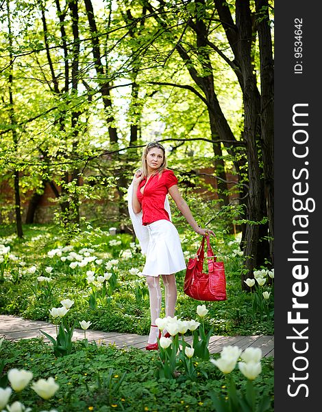 Portrait of woman in red dress in nature