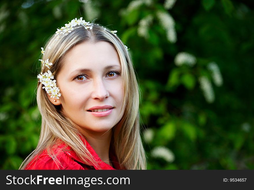 Portrait of woman in red dress in nature