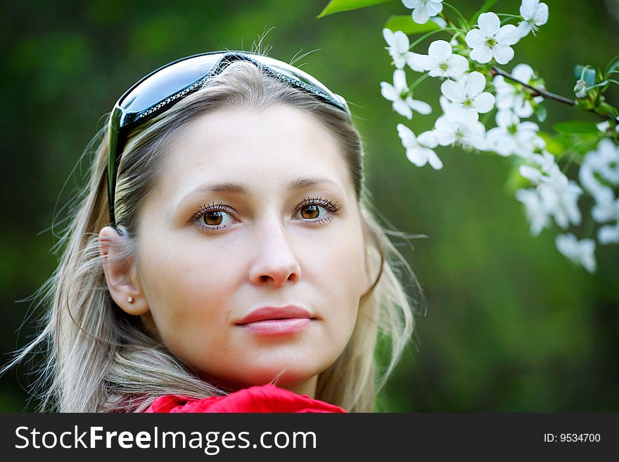 Portrait of woman in red dress in nature