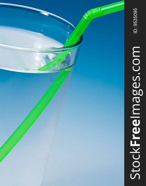 Glass of water on blue gradient background