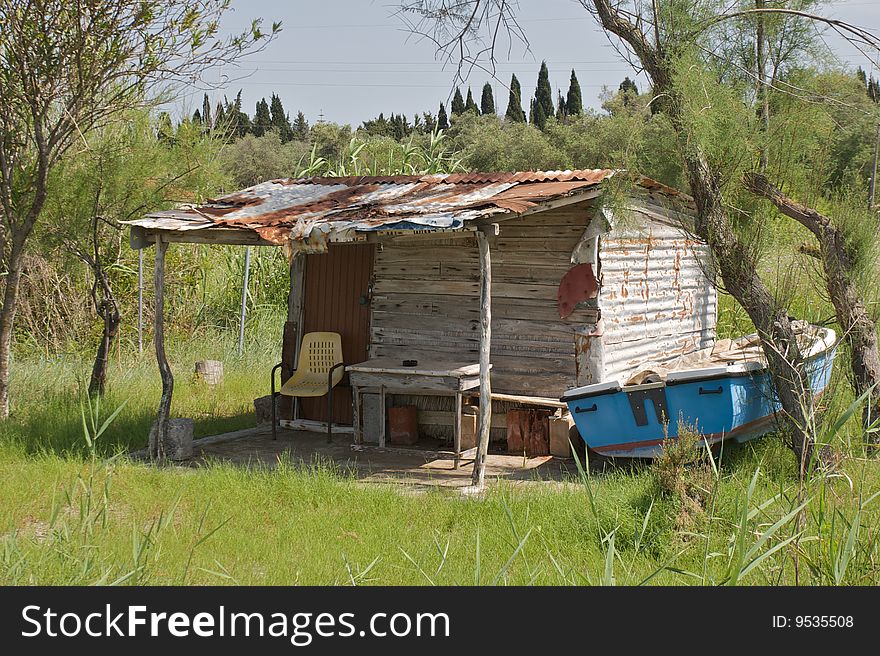 Old fisherman cabin and boat in Corfu Greece