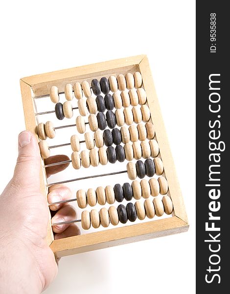 Wooden abacus in hand on white ground