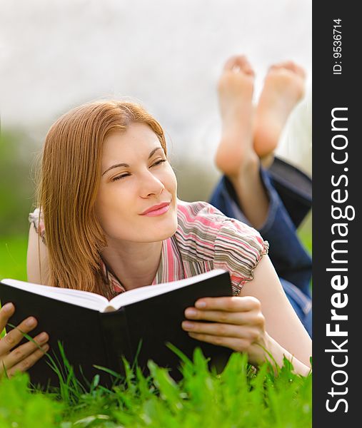 Pretty Girl Reading Outdoors