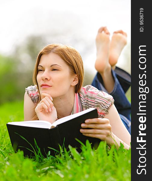 Pretty Girl Reading Outdoors