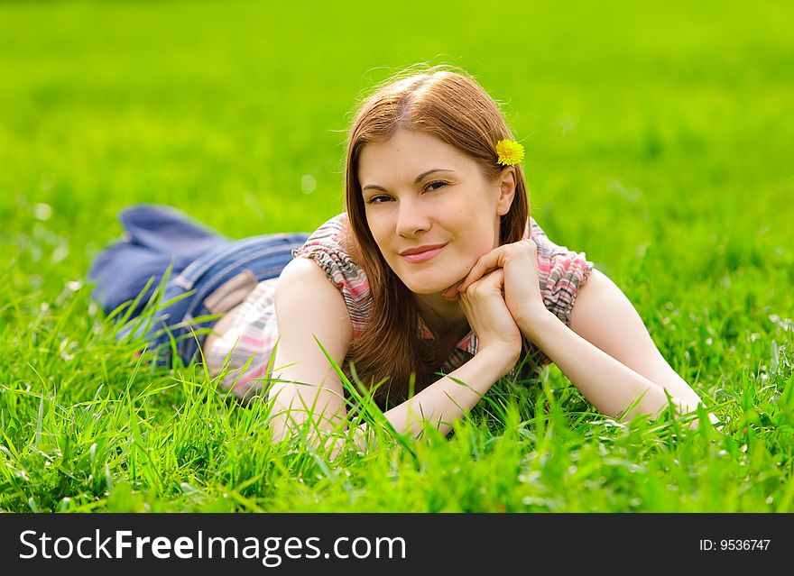 Pretty smiling girl relaxing outdoors. Pretty smiling girl relaxing outdoors