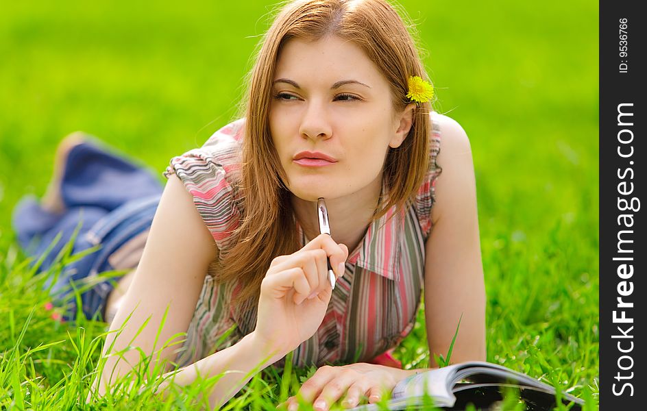 Pretty serious girl studying outdoors. Pretty serious girl studying outdoors