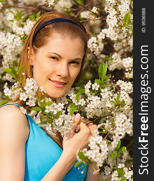 Beautiful girl with flowers relaxing outdoors. Beautiful girl with flowers relaxing outdoors