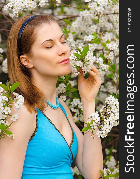 Beautiful girl with flowers relaxing outdoors. Beautiful girl with flowers relaxing outdoors