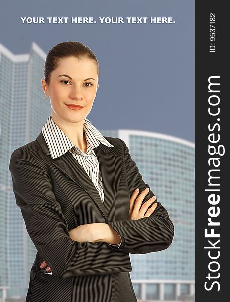 Attractive business woman against business center