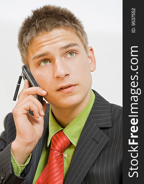 Young businessman talking on the cellphone. Young businessman talking on the cellphone