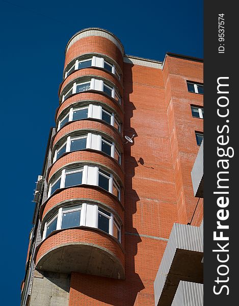 Modern apartment building against clear blue sky