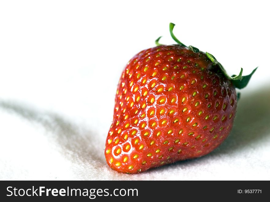 Red strawberry against a white background