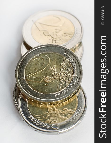 Several euro coins on white background