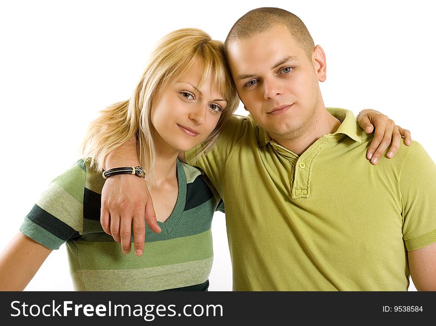 Embraced young couple over white background