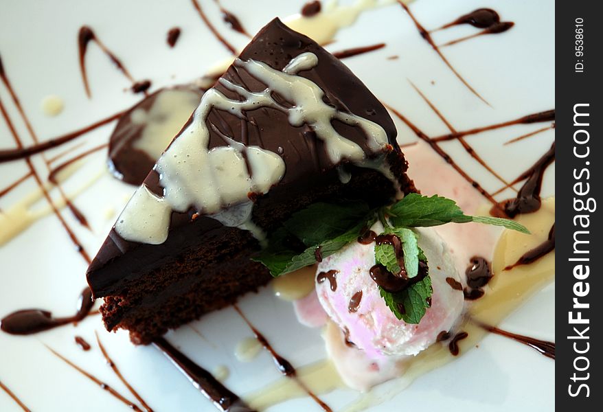 Cake and ice-cream on a white plate