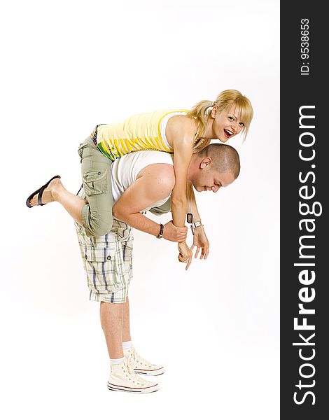 Young man holding his girlfriend in the air