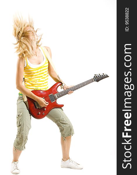 Headbanging girl guitarist playing